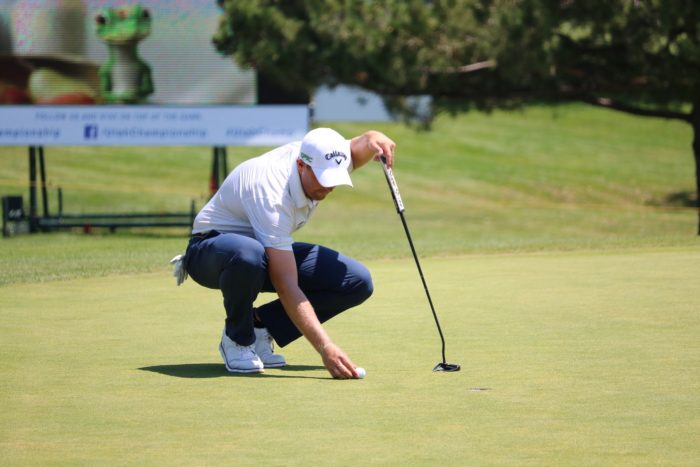 Golfer Lining Up His Putt at the Utah Championship in Davis County