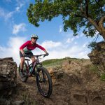 Woman on mountain bike rides on Fruit Loops trail in Fruit Heights Mountain Bike Park