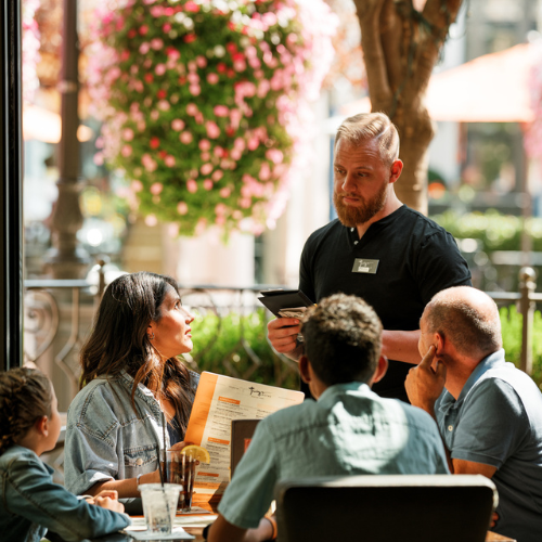 A family having a meal at Twig's Bistro in Station Park