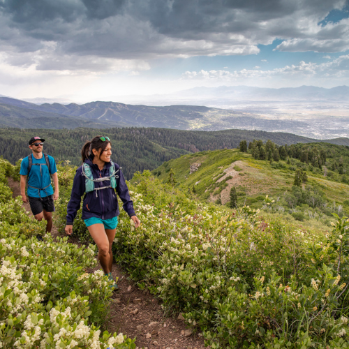 Couple hiking in the mountains in Davis County Utah