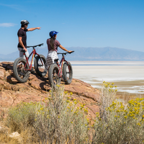 Couple mountain biking on Antelope Island State Park