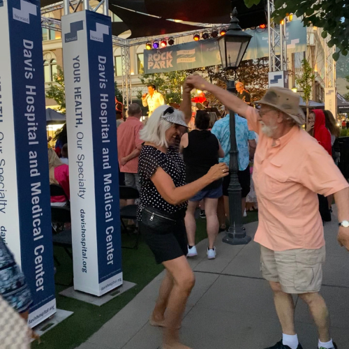 A couple dancing at concert in Station Park Farmington