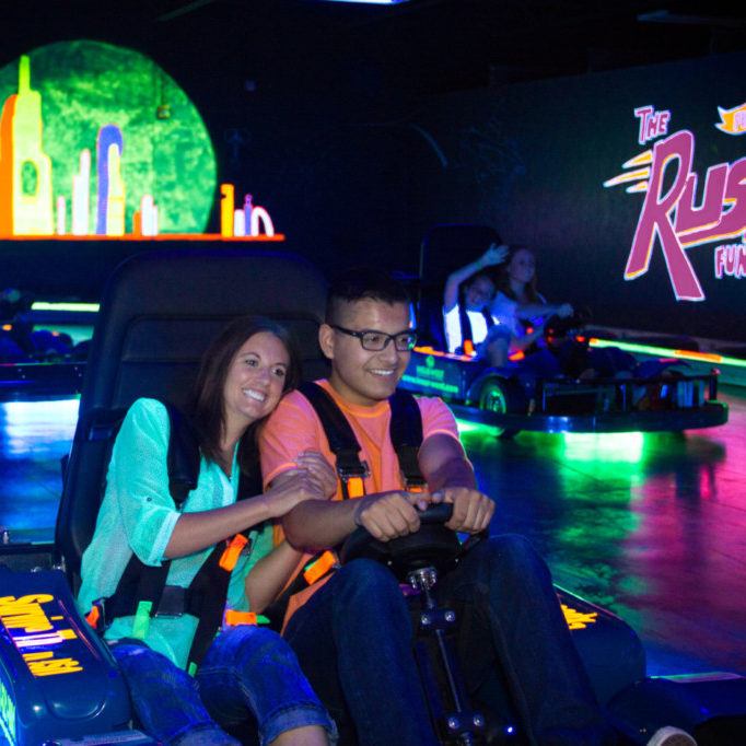 Couple on indoor go-karts at The Rush Funplex Syracuse.