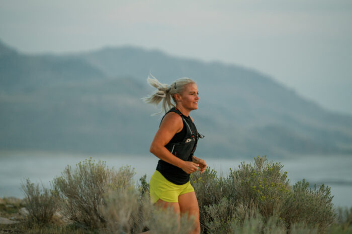 Woman trail running at Antelope Island State Park