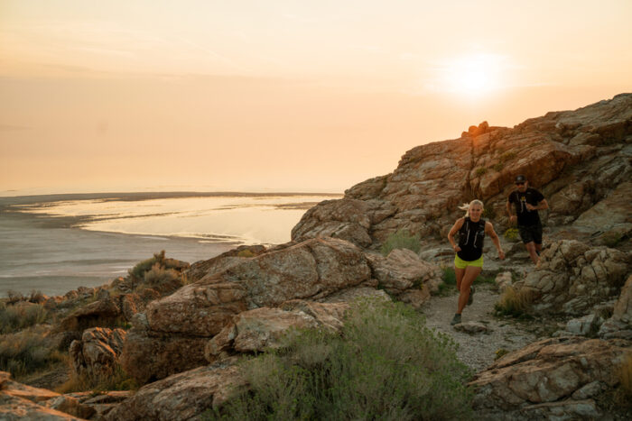 Couple trail running at Antelope Island State Park